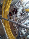 Cable jockey rod with wheels