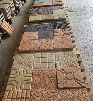 Machine pour production des carreaux a beton